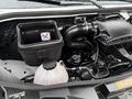 A 2019 Mercedes-Benz Sprinter engine compartment showcasing the air intake system and coolant reservoir