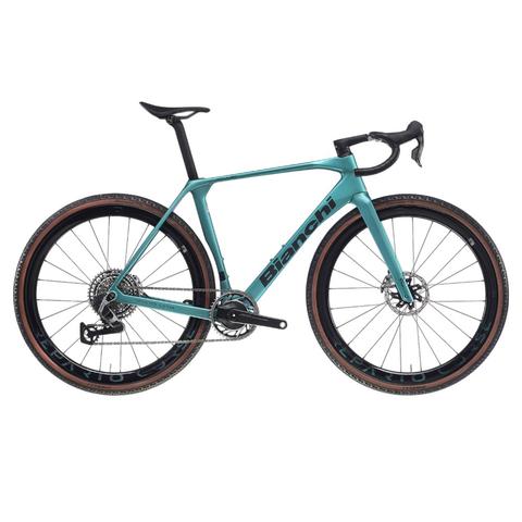 2026 Bianchi Impulso RC SRAM RED XPLR AXS Carbon Race Gravel Bike with a sleek teal frame and black components featuring wide tires designed for gravel terrain