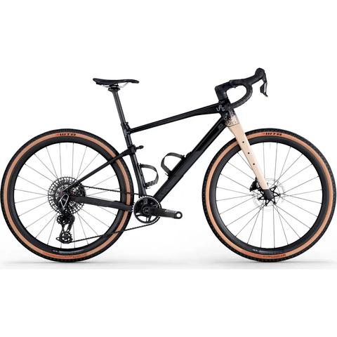 A 2026 Bmc Urs 01 One bicycle featuring a black frame with a tan fork and wide tires designed for gravel riding