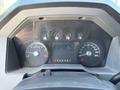 Dashboard of a 2012 Ford F-450 SD showing speedometer and various gauges with a digital display in the center