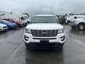 A white 2016 Ford Explorer displayed head-on with a distinct grille and headlights visible