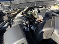 Close-up view of the engine compartment of a 2023 RAM 3500 showcasing the air intake and various engine components