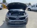 2022 Kia Sorento with the hood open showcasing the engine compartment and engine components visible inside