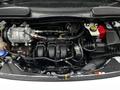 Engine compartment of a 2019 Ford Transit Connect displaying the engine, various components, and hoses without any visible cover