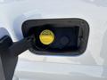 A fuel cap on a 2020 Ford F-350 SD with a yellow cap indicating diesel fuel inside the fuel access door