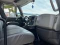 Interior of a 2019 International 4300 featuring a driver's seat and dashboard with a steering wheel and control panel visible