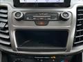 Dashboard console of a 2019 Ford Transit Connect featuring audio controls climate settings and a storage compartment