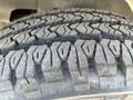 Close-up of a tire tread on a 2012 Chevrolet Express showcasing the detailed patterns and grooves for traction and grip