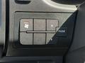 A panel of control buttons in a 2021 RAM Promaster featuring a fan icon several directional buttons and a mode selector button