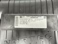 A vehicle emission control information label for a 2014 GMC Savana detailing regulations and fuel specifications