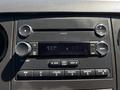 Dashboard of a 2014 Ford F-250 SD featuring a radio display with buttons for CD AM FM and auxiliary inputs