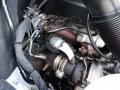 Close-up view of the engine components of a 2016 Mercedes-Benz Sprinter including turbocharger and piping