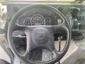 The interior dashboard of a 2007 Morgan Olson Workhorse W42 featuring a steering wheel gauges and various controls