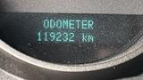 A digital odometer display showing the word ODOMETER and the reading of 118232 km