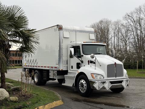 A white 2017 Kenworth T370 box truck with chrome accents and a large cargo area is parked with its front facing the viewer