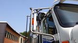 A 2003 International 5600i truck showing the cab and side mirrors with chrome detailing and an orange marker light