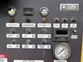 Control panel of a 2009 Spartan Gladiator featuring various buttons switches and gauges for function operation and monitoring