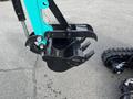 Close-up of the claw attachment on a 2024 AGT Industrial Green QH13R Mini Excavator showcasing its digging and gripping features