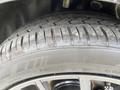 Close-up of a tire on a 2017 Dodge Challenger showcasing the tread pattern and sidewall markings