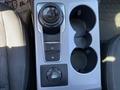 2023 Ford Bronco Sport center console featuring gear selector dial parking brake button and two cup holders