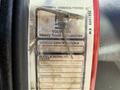 A close-up of a vehicle identification label from a 1994 Volvo FE 42 showing details like vehicle identification number model and serial number and transmission information