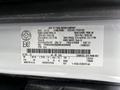 2022 Ford Transit with a detailed label displaying manufacturing information and specifications