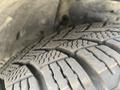Close-up of a tire with deep tread patterns on a 2017 Acura TLX