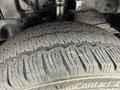 Close-up of a tire from a 2021 Ford Transit showing tread pattern and sidewall details
