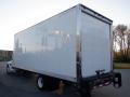 A 2014 International Durastar truck with a large white cargo box and a rear roll-up door