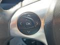 Steering wheel control buttons including an OK button and directional arrows