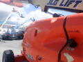 A 2008 JLG Boom Lift in orange with a label reading gasoline and model number 400S visible on the side