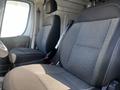 Interior view of a 2021 RAM Promaster showing two black fabric front seats with a simple design and no visible markings or patterns