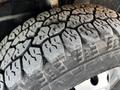 A close-up view of a rugged tire tread on a 2017 RAM Promaster showcasing deep grooves and a textured surface