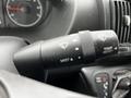 Close-up of a RAM Promaster vehicle's control stalk featuring mist and trip reset functions with various symbols displayed on the dial