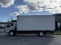 A 2007 GMC W5500 18 foot cube van with a white cargo box and visible wheels parked on a paved surface