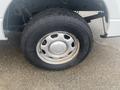 A close-up of the wheel and tire of a 2013 Ford F-150 showcasing a silver rim and rugged tire tread