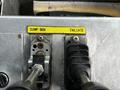 Controls for dump box and tailgate on a 2010 Freightliner M2 106 with labeled switches and levers