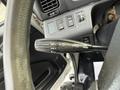 Close-up of the turn signal lever in a 2017 Hino 338 with markings for off left right and pass functions