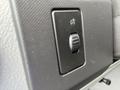 Close-up of a control switch with a knob designed for adjusting settings inside a 2009 Ford Econoline