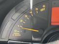 Tachometer of a 1992 Chevrolet Corvette displaying engine RPM with needle positioned near 1 indicating low revolutions per minute