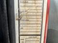 Detail view of a 1994 Volvo FE 42 identification tag showing specifications for rear and front axles cab paint and serial numbers
