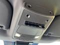 The overhead console of a 2021 Ford F-550 featuring multiple switches and lights integrated into a textured panel