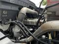 A 2017 International WorkStar 7600 engine with visible pipes wires and components exhibiting a complex arrangement of machinery