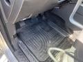 The floor mat of a 2014 Ford F-150 with a textured surface designed for weather resistance and dirt retention