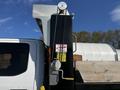 2021 Ford F-550 with a flatbed and a dump bed feature visible on the back side of the vehicle