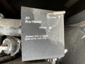 A tag attached to a component of a 2000 Ford Motorhome indicating settings for an air pre-heater with instructions for replacing the filter only
