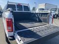A 2017 Ford F-150 with its tailgate down revealing the truck bed and a covered liner