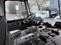 Interior view of a 2010 Autocar Xpeditor showing the steering wheel and dashboard control panel with various switches and gauges