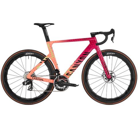 2025 Canyon Aeroad CFR AXS Road Bike featuring a striking gradient frame design with black wheels and a sleek aerodynamic profile