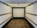 Interior view of a 2018 Hino 195 truck's cargo area featuring a wooden floor and wooden side panels